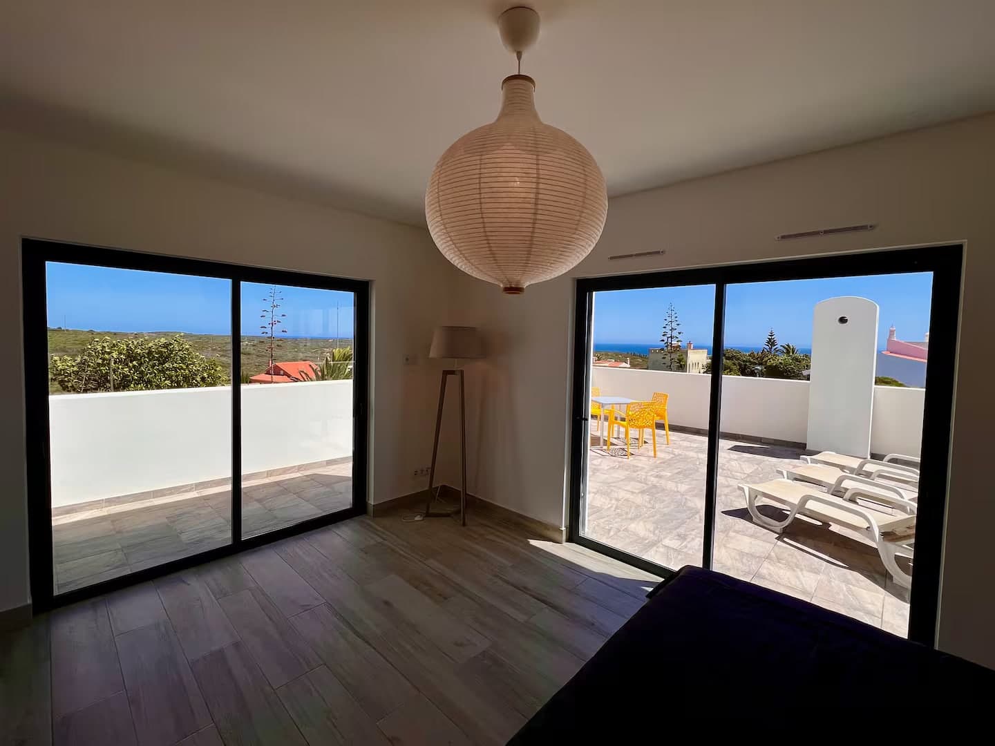 Upstairs double bedroom with two doors to the terrace